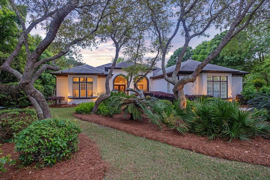 Sitting on a half-acre lot, this charming residence, which was remodeled in 2011, boasts a wealth of outdoor living space that has been carefully landscaped to create a stunning poolside oasis. To the rear, paved terraces and screened patios are sheltered behind high hedges, providing privacy and natural beauty. Head into the screened porch where a fully equipped summer kitchen stands ready for alfresco cooking and dining. This outdoor space is an idyllic place to relax and entertain on a summer evening overlooking the saltwater pool and spa. The gas fireplace makes this a year-round haven for outdoor living! This is a grill master and entertainers paradise!  Inside the ten- and 12-foot ceilings and an oversized fireplace lend a cozy focal point.