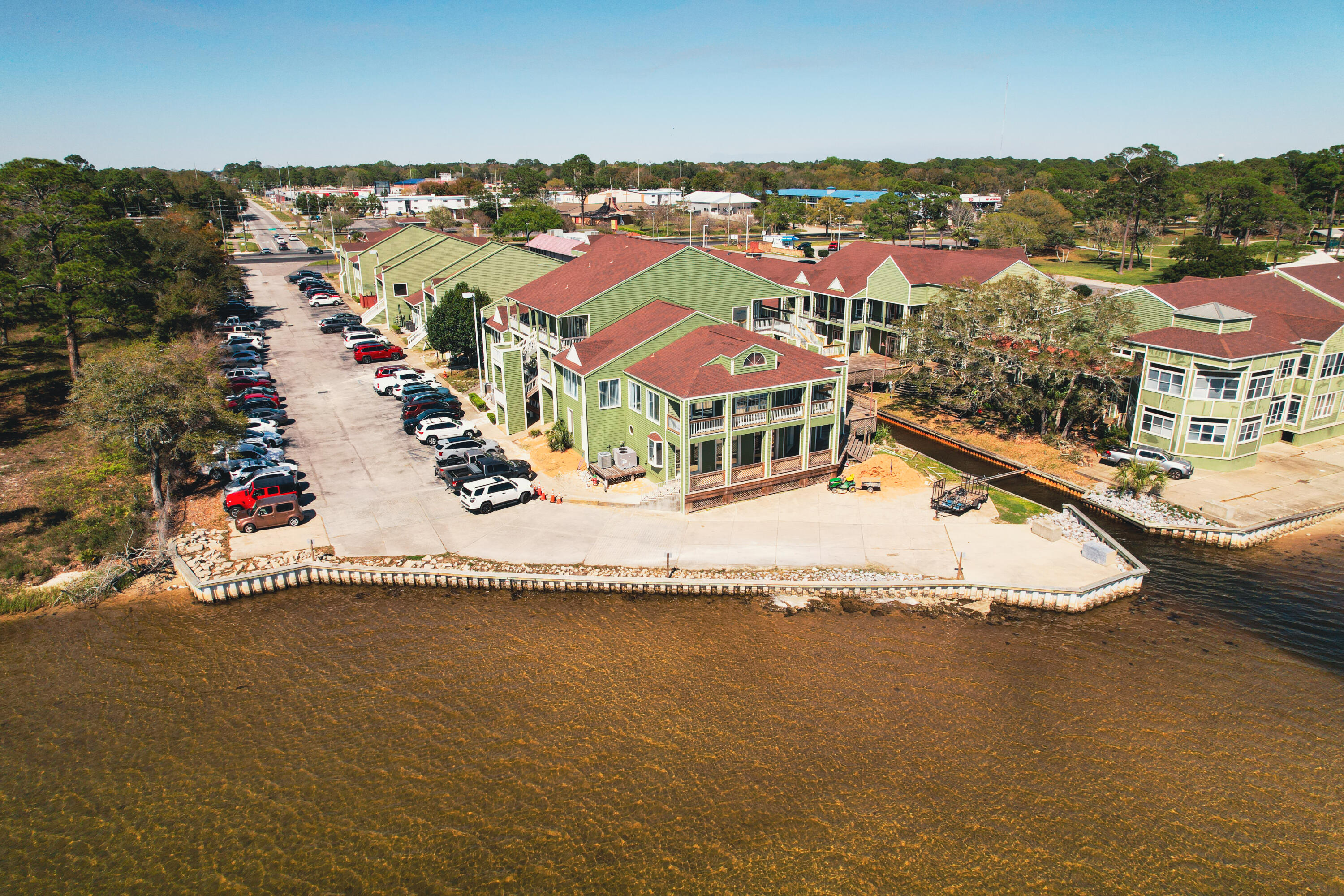 Consider this beautifully appointed 2,000 SF office space in Paradise Village Professional Park, Fort Walton Beach. Located on the third floor, this suite offers elevated views overlooking the interior greenspace and toward Santa Rosa Sound, with several offices having balcony access. The layout includes a versatile mix of private offices, open work areas, break room, and three restrooms, making it ideal for a wide range of professional uses. Paradise Village fronts Highway 98, with ample onsite parking, and is home to a strong tenant mix including healthcare, financial, real estate, spa, and defense-related businesses, and is strategically positioned just 5 miles from Hurlburt Field, 9 miles from Eglin AFB, and 11 miles from Destin-Fort Walton Beach Airport (VPS), this location offers both accessibility and prestige.