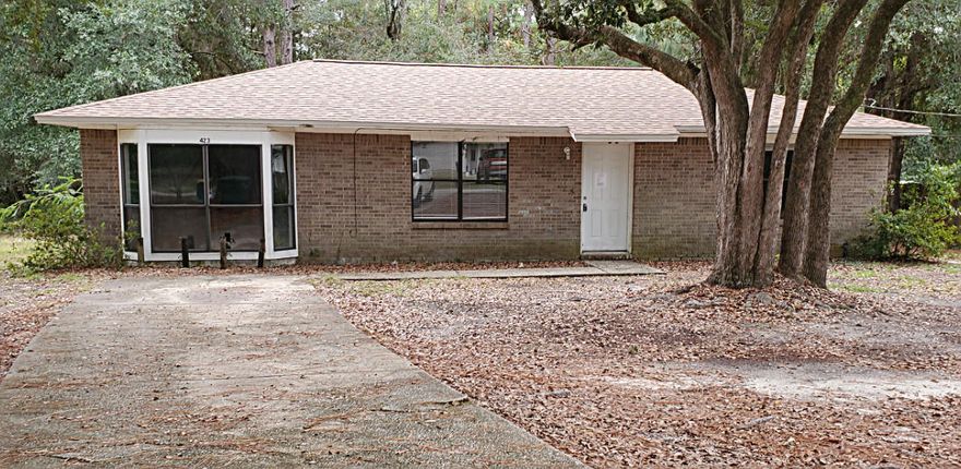 Wonderful neighborhood! Brick home has great rental potential or buy it for an affordable investment homestead. Pull up on the paved driveway to be greeted with beautiful oak trees adorning the yard for your viewing pleasure. The home could use some cosmetic touches but so worth it. Brand new roof and water heater. All appliances stay with the home. Master bedroom has a bay window and a full bath with a large soaker tub. You will love that the laundry room is inside and measures 8ft x 5ft. The location is perfect as it is South of I-10, only 45 minutes to sugar white sand beaches, and within 40 minutes to Duke, Hurlburt, 7Th special Forces, and Eglin. Close to shopping, medical facilities, countless restaurants, and schools. 