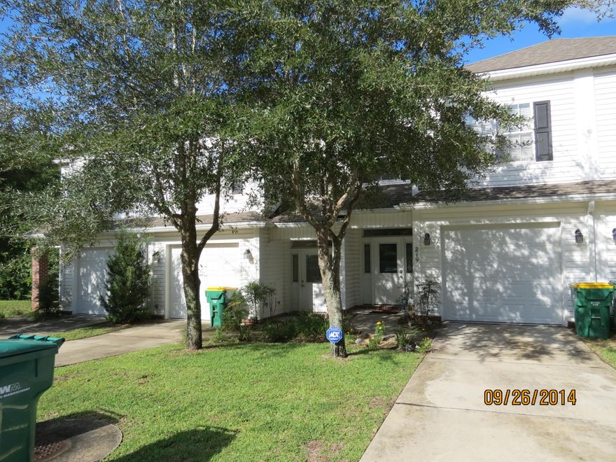 Enter this very nice town home into an open foyer accented by twenty foot ceiling and lighted by a hanging chandelier. The stairway leads to three bedrooms with nine foot ceilings, two full baths, and a laundry center upstairs. Master bedroom is equipped with a large walk in closet. Master bath features a jetted garden tub, separate his and hers vanities, and a separate shower. The downstairs is an open great room with high ceilings and fireplace. The kitchen features a breakfast bar, an open view of the living and dining areas, all appliances, and hard surface countertops. Crown molding accents the living room, kitchen, master bedroom, and master bathroom.