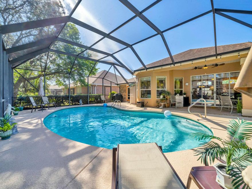 Welcome to your dream home in the highly desirable Indian Lake neighborhood! This elegant pool home offers the perfect balance of comfort, style, and convenience- just minutes from shopping, restaurants, and the white-sand beaches of Destin. Soaring 10 and 11 foot ceilings, large windows, and beautiful hardwood floors create an airy feel throughout the main living areas and master suite. Designed for privacy, the split floor plan separates the master bedroom from the guest rooms. Retreat to a spacious master with a walk-in closet and a spa -like bathroom featuring double vanities, a whirlpool tub, and a separate shower. The modern kitchen is outfitted with sleek stainless steel appliances and pull out drawers perfect for home chefs and entertainers. Gather in the cozy living room around  the gas fireplace and enjoy easy access to the covered lanai and pool area. The living room and master bedroom open up to the lanai covered pool area making it an ideal space to relax and entertain in any season. Whether you're looking for a full-time residence or a coastal getaway, this home checks all the boxes.