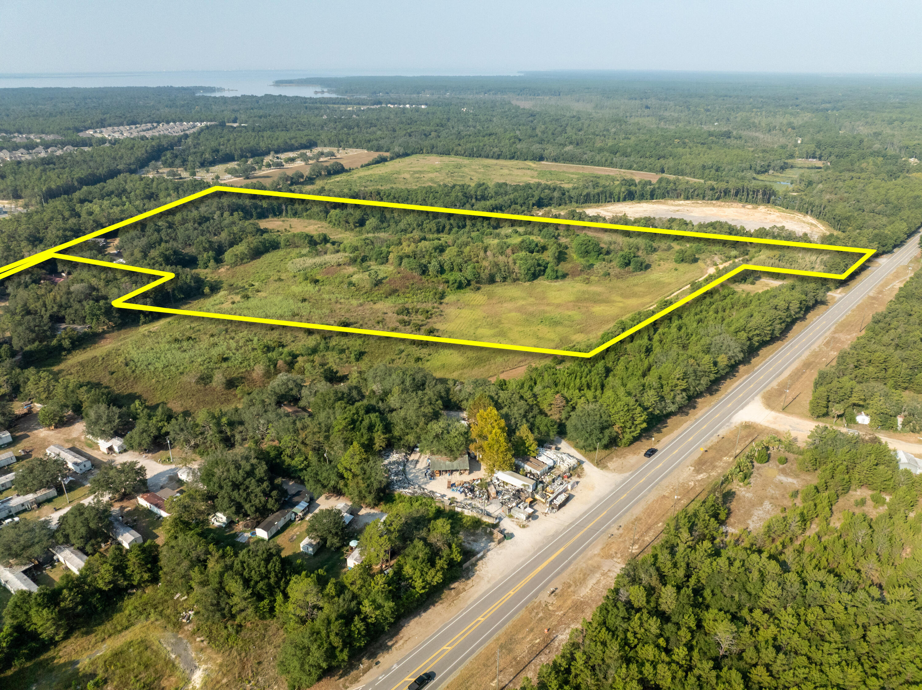 +/-25 acres zoned Rural Residential (per F.L.U.M.) in the City of Freeport of Walton County, Florida. The buyer must verify all information, not the least of which includes environmental aspects of the property and former use(s).