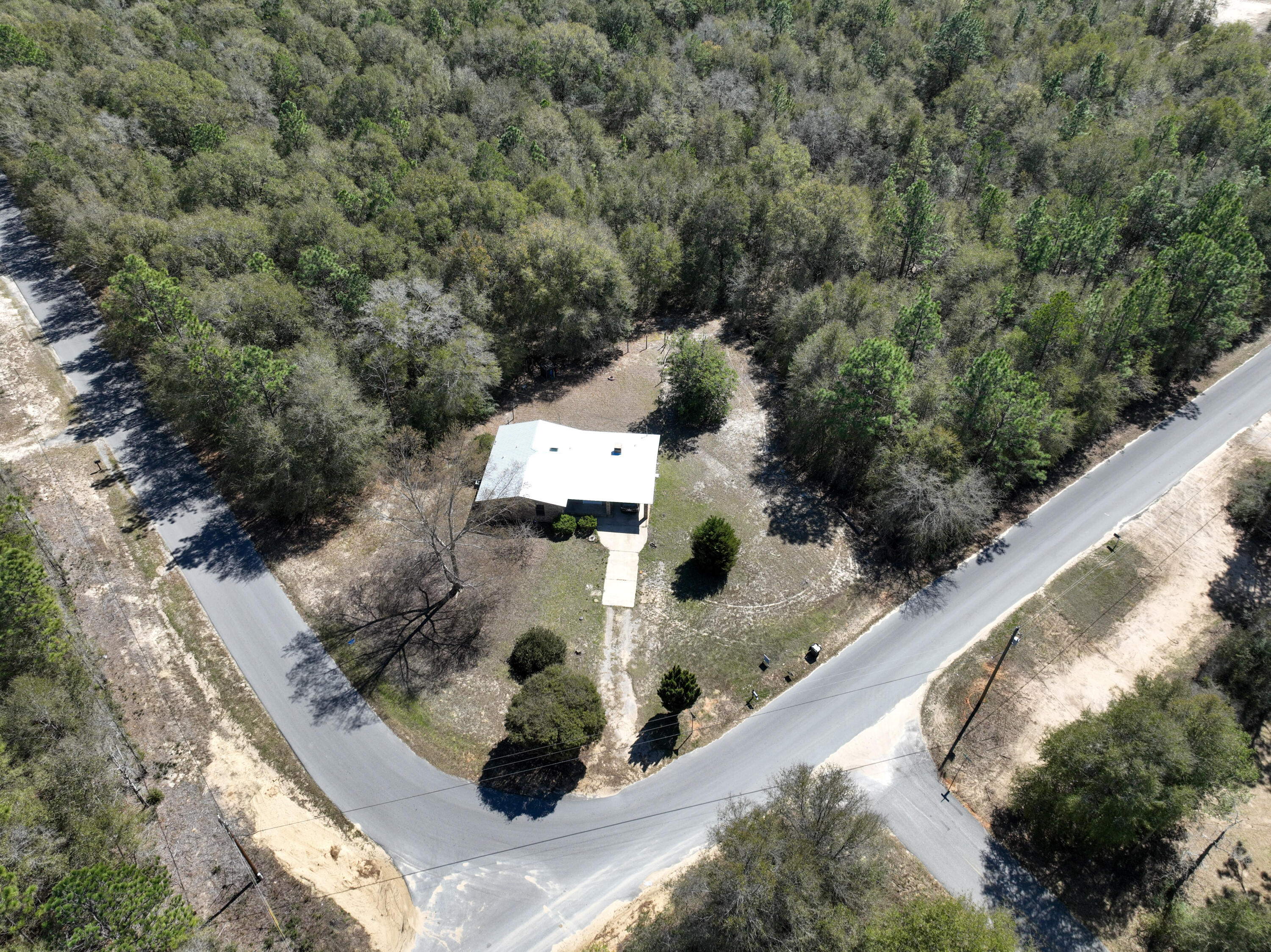 Priced to sell! All brick home on a large lot with new metal roof. Privacy with two vacant lots adjacent to the home that can be purchased as well. Home has been a rental and great investment.
