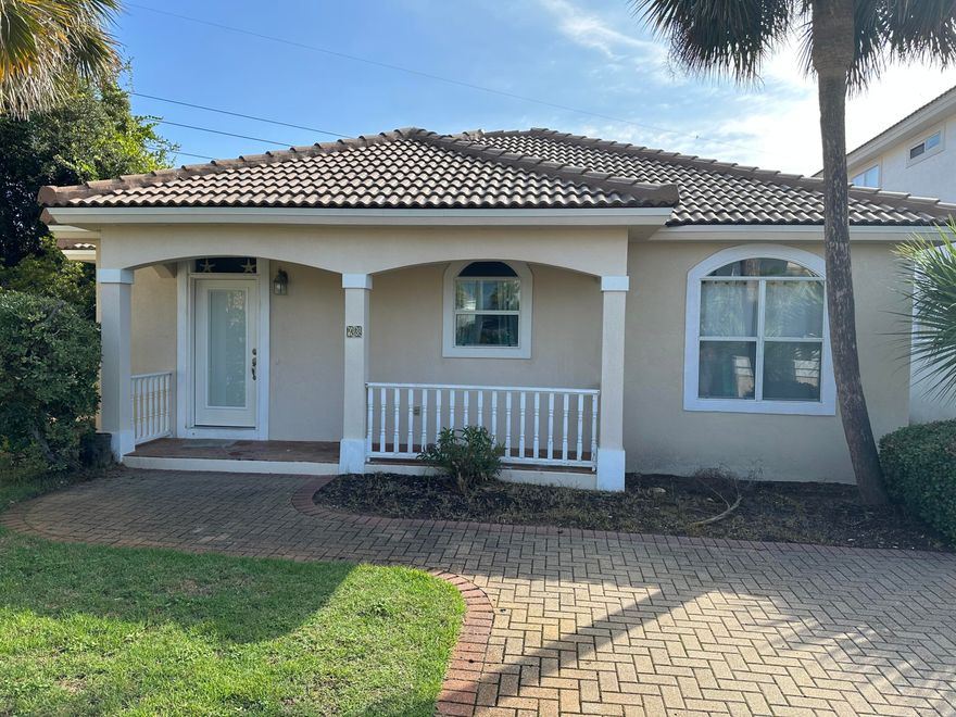 Nicely landscaped, well-kept home in quiet area. Large deck out back shaded with large Palm Trees. Tiled floors except for bedrooms. Separate dining room, very open kitchen. In close proximity to the beach, community features a with volleyball court, tennis, and swimming pool.