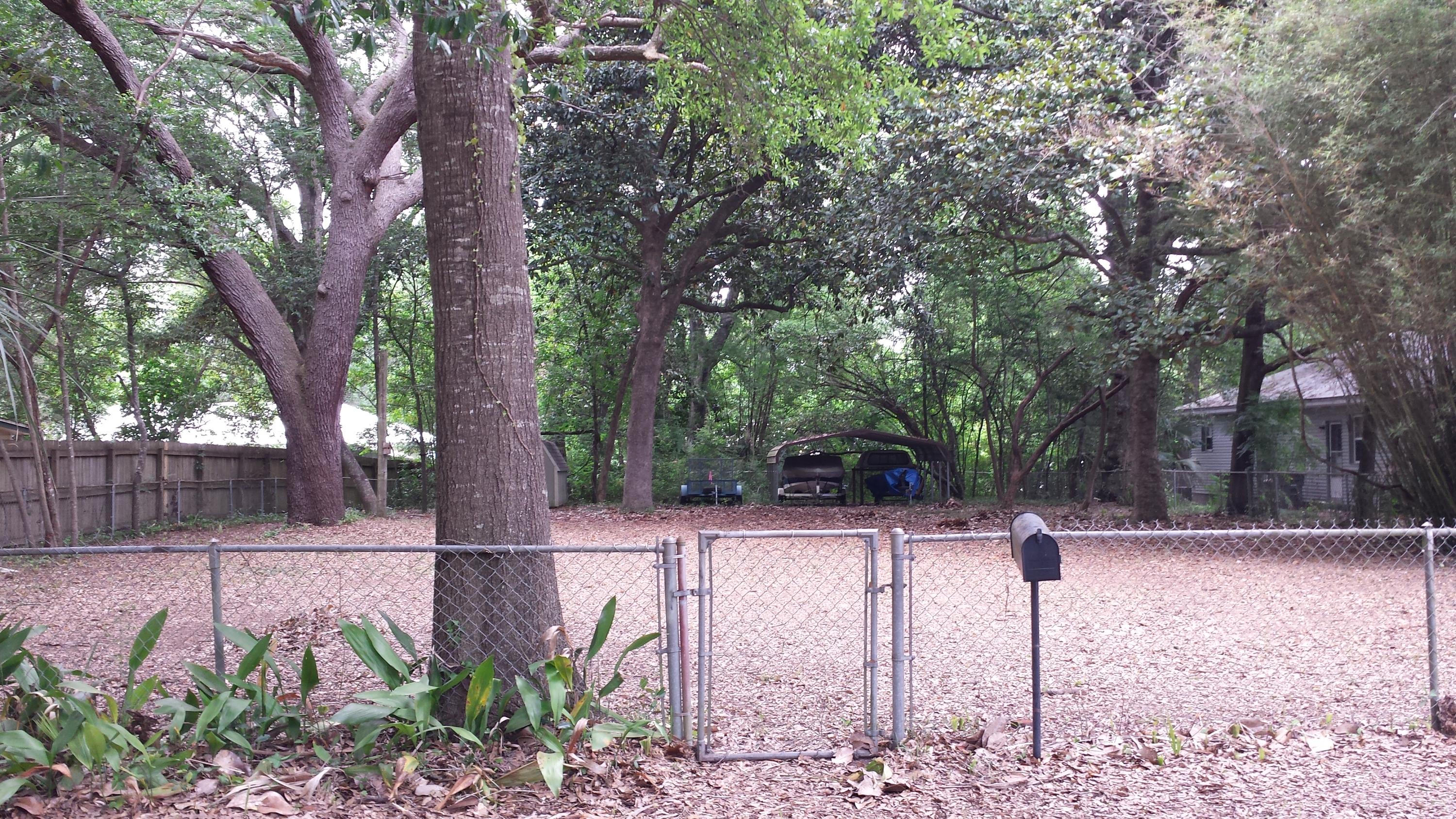Gorgeous lot! Ideal location! Ready for you to build your dream home! You'll have a 3 minute walk to Lincoln Park on Boggy Bayou, and a 3 minute drive to base! You'll be half a mile from the ValP fishing pier where you can while away the afternoon. Beautiful mature trees, fence surrounding the property and utility taps are already in place! There is a 8x12 utility shed on the property for storage and a carport. Come see it today and envision your new home!