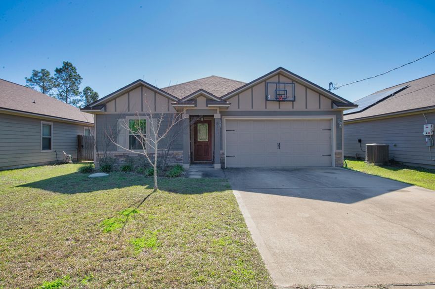 Turn the corner onto Sierra street and you will notice multiple beautiful hardiplank and brick homes within sight, and just a little ways lies 8169 Sierra. This home invites you in with it's long driveway into the two car garage, the dark and light browns on the outside are soft and inviting. Stepping through the front door you are greeted with a short hallway that leads in, 3 bedrooms and a bathroom on the left and on the right, a beautiful kitchen, complete with stainless steel appliances to include a wine fridge. Grab a glass and walk into the living room and sit underneath the double trayed ceiling. Out back you will see a fire pit and covered patio with a yard big enough to have a few outdoor activities but not so big that it will be a major chore to mow each week. The master bedroom