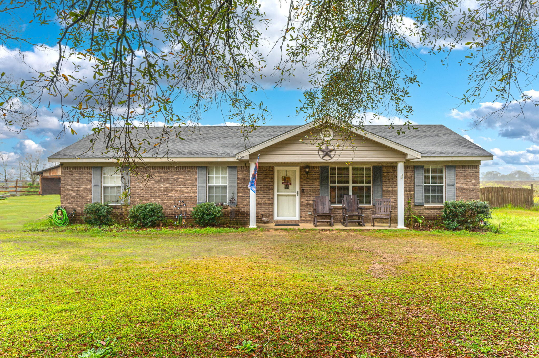Looking to move to the country away from the hustle of town, this brick home offers you 3 bedrooms, 2 full baths, a large living room and a great kitchen dining combo. Home has tile throughout as well laminate flooring. Home has many custom features added by homeowners to also include a large 11x13 add on in the back perfect for the kids or a entertainment room along with an additional storage added to it.  Property offers a large barn, beautiful trees, privacy and room for kids to run or a garden. Solid brick home - call today to view this one!