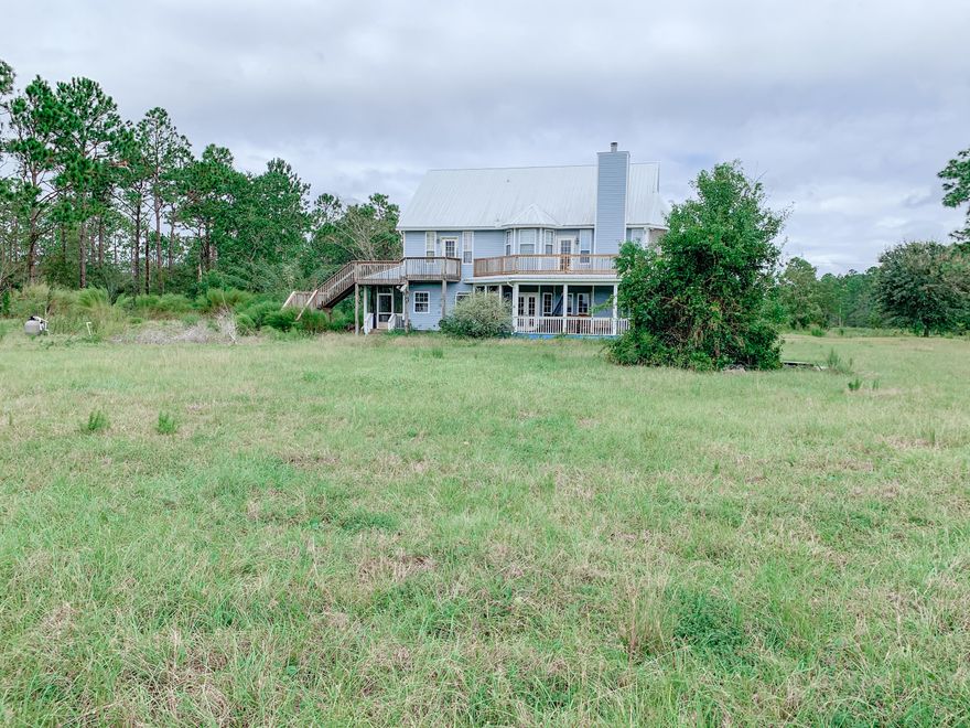 Beautiful Victorian home with 8-stall barn, situated on just over 25 acres, convenient to Gulf Breeze and Milton. Home, barn and land are being sold 'As-Is'; however, with some TLC and hard work, this could be an equestrian's dream!