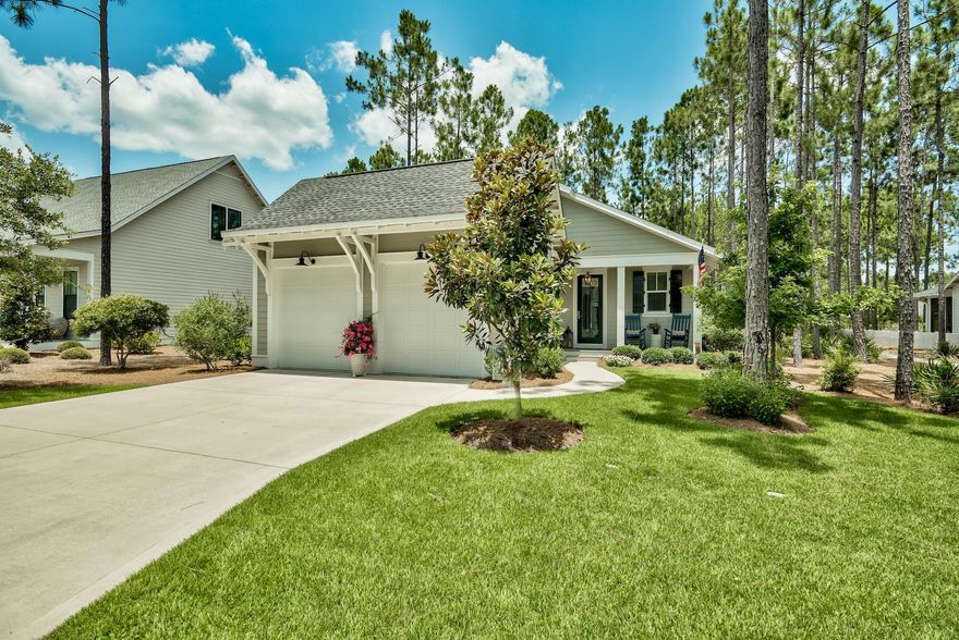 STYLISH & SOPHISTICATED! Tons of upgrades and delightful extras at every turn. This popular open floor plan offers gorgeous hardwood and tile flooring plus all stone quartz countertops throughout. The true gourmet kitchen boasts a custom lighted dry bar, island with sink, fine cabinetry, stainless steel appliances and flows nicely into the dining area, great room and screened porch to provide a welcoming flexible space to entertain and relax. Generous bedroom suites each with modern bathrooms. All of this and supremely situated on a pristine HARDSCAPED lot with fenced backyard. Park behind the home, privacy galore. There's nothing to do but unpack and enjoy! Watersound Origins offers golfing, a fitness center, 5 miles of bike trails, dock access to Lake Powell, swimming & more!