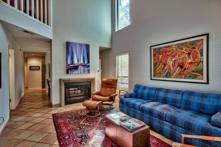 Whether searching for a vacation getaway or rental investment, here is a charming 2 bedroom, 2 bath lake front condo located in the sought after Tennis Village in Tops'l Beach and Racquet Resort. Inside you will find a 1,525 square foot open floor plan, with tile flooring throughout living areas and bathrooms. The family room has dramatic cathedral ceilings adjacent to the dining room that opens to the kitchen and breakfast bar. The first floor also contains a guest room with bathroom, as well as access to the outside patio and dock. Upstairs discover a huge master bedroom sitting area and private balcony overlooking the lake and ensuite bath with double vanities, jetted tub and separate shower.