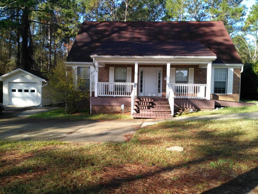 This home sits on approximately 1/2 acre and has an awesome lake view from the large covered front porch. The living room is spotlighted with a fireplace for you to enjoy during the cool nights or winter months. There is a main bedroom on the first floor and two more upstairs. The first floor bathroom has a walk in jetted tub with shower. Upstairs has another full bath. This home has tile throughout the 1st floor and carpet upstairs. Both baths have tile flooring. Come take a look....this could very easily be your next dream come true.