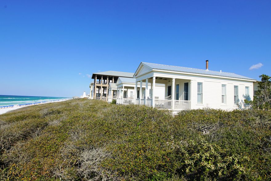 Located in the community of Seaside, selected by Time magazine as one of its ''Designs of the Decade''. This classic Florida beach cottage was modeled on Thomas Jefferson's Cottage at Monticello. A two story cottage beautifully set into the dune, finely crafted, yet an unpretentious hideaway. Designed by Scott Merrill, it was awarded a National American Institute of Architects Award of Excellence. The all wood interior is painted a crisp white. Master bedroom, private screen porch with outdoor whirlpool tub surrounded by a natural grove of oaks, all on first floor. The living area with extended ceiling is surrounded with windows allowing light to fill the entire second level. Build a fire in the wood burning stove to warm those chilly winter evenings. Assigned parking