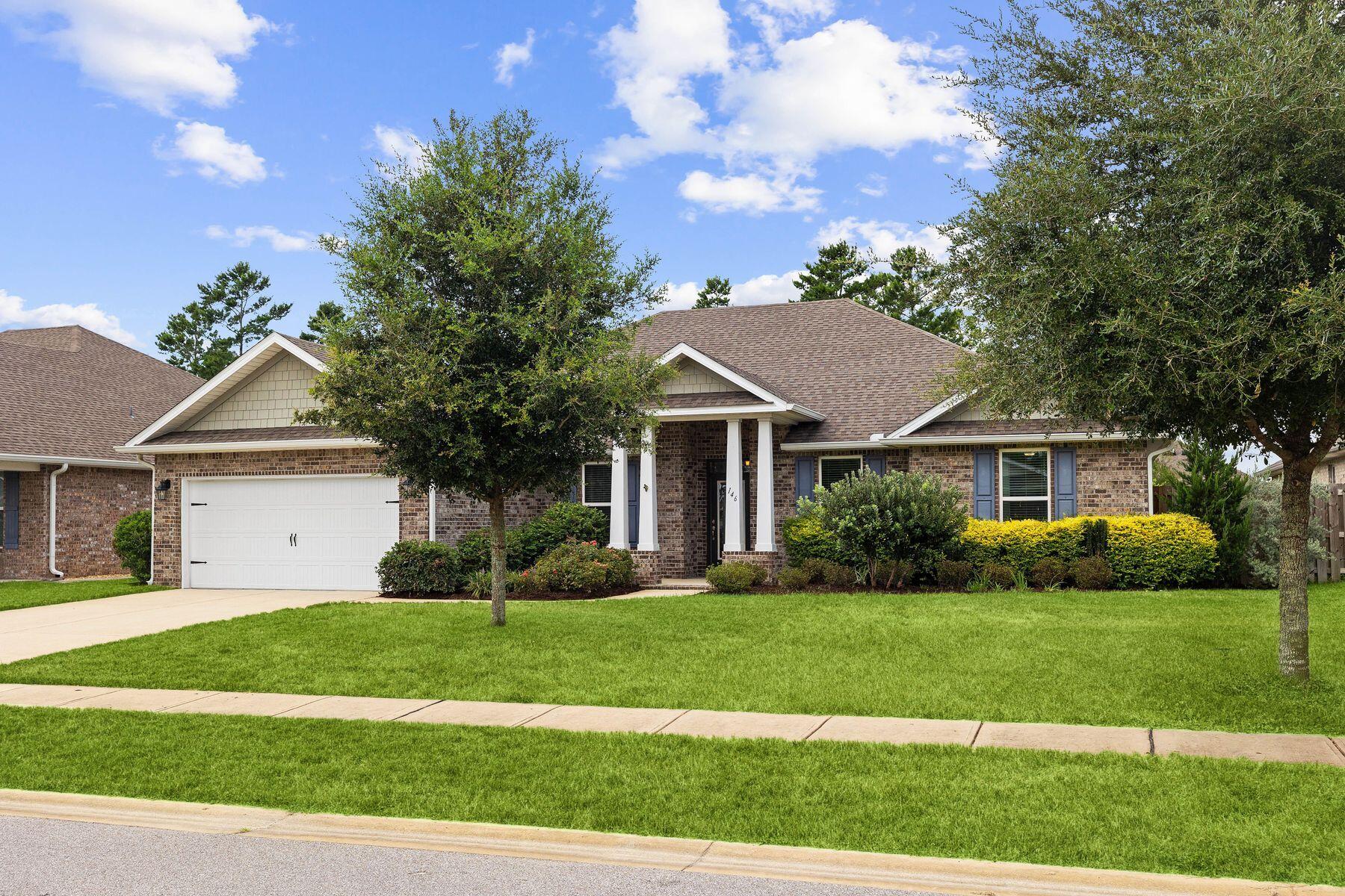 Seller offering $2500 Closing cost credit to Buyers! Discover the highly coveted neighborhood of Hammock Bay and find your dream home at 146 Sweet Tea Lane! This one story split floor plan includes a formal living and dining area with four bedrooms and three full bathrooms. Enjoy the luxury of wood tile floors, crown molding and 12' ceilings in the great room. The gourmet kitchen includes granite countertops, stainless steel appliances, a glass tile backsplash and a dual fuel range. The spacious master bedroom has a tray ceiling accent, while the master bath has a tiled soaker tub and separate tiled shower. Three additional bedrooms are available for family or guests or use as flex space. An extended screened back porch is perfect for relaxing and entertaining. The backyard includes a garden area, storage shed, pergola and privacy fencing. Make the move easy on yourself, and purchase the whole house furnishings package. Information available upon request. Hammock Bay community provides an array of amenities including resort style pools, an impressive fitness center, tennis and pickleball courts. miles of walking trails, sports fields, a dog park and playground. An outdoor stage and indoor movie theater make family entertainment part of the local lifestyle. For your convenience, there's a corner store and a micro brewery with space for tasty food trucks to pull up and showcase a variety of fresh cuisine. The brand new Freeport Middle School at Hammock Bay just opened for the 2024 school year.