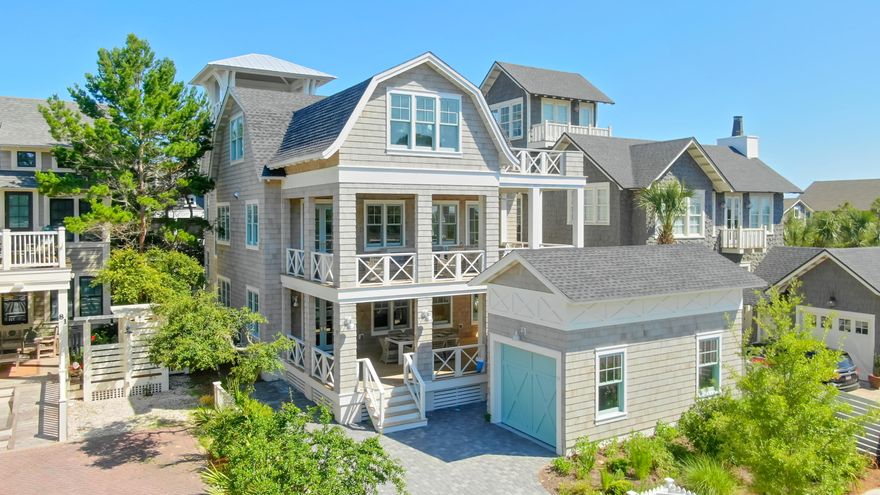 Exquisite custom home with views of the Gulf of Mexico and the private dune walkovers to the sands of WaterSound Beach!This distinguished Harrison Design Home offers 3 floors of gracious living and boasts the finest of finishes which includes stunning Walnut hardwood flooring with custom stain, striking reclaimed beams throughout the 2nd floor, and architecturally impressive 8' Rain Wall falling 18 ft from 2nd floor to evoke a refreshing and relaxing water feature that is unlike any other home. This breathtaking property with an elevator, oversized observation tower with stunning Gulf views, and over 2,400sf of outdoor living on the spacious porches, is a masterpiece and in a class of