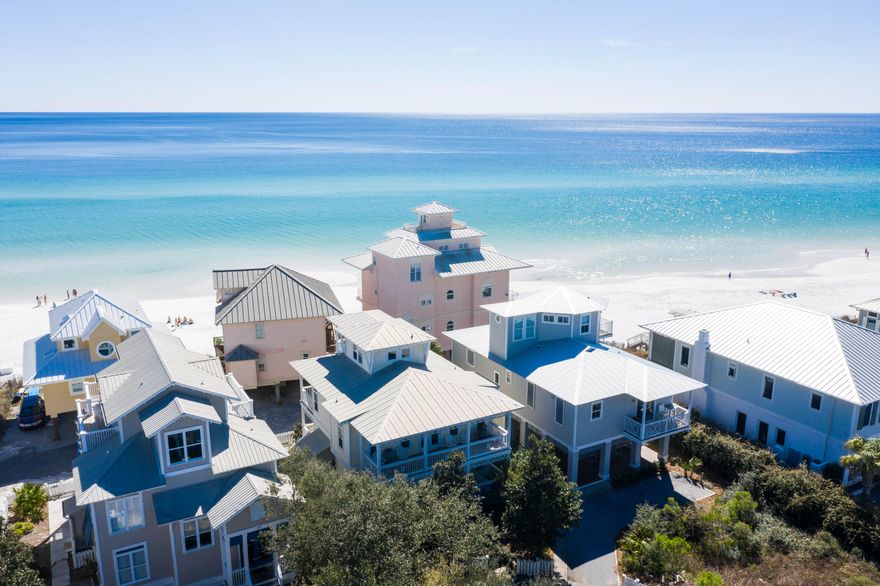 A true gem presents itself at 70 South Ryan Street along spectacular Scenic Highway 30-A in Santa Rosa Beach, Florida. This coastal beach retreat in the Seagrove area is sure to impress with stunning views and convenient beach access just a few feet from the home. Rental income potential over $100,000 per year gross has been projected by multiple local rental companies. The 4 bedroom, 3 full bathrooms and one half bath design couples coastal contemporary elegance with classic Florida beach cottage overlooking one of the more private beach settings along 30-A.
