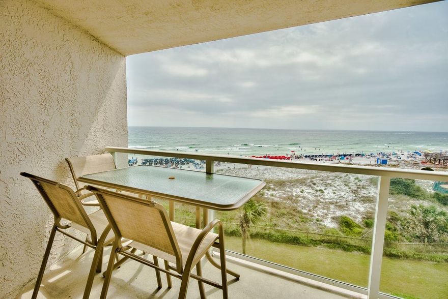 Unique floor plan with BUNK room! This one bedroom one bath condominium has an additional bunk room with a single bunk over a double bed! Located on the fifth floor, this is the perfect height in the building with a western orientation for those exceptional sunsets over the Gulf of Mexico.  Beautifully renovated throughout with coastal colors and decor including tile floors throughout and even tile baseboards for ease of maintenance.   The kitchen features granite countertops, stainless steel appliances and custom cabinetry.  New pendant lights with gold accents highlight the breakfast bar. A new  light with inset fan highlights the glass top dining table and  there is  a built in serving area with additional storage.
