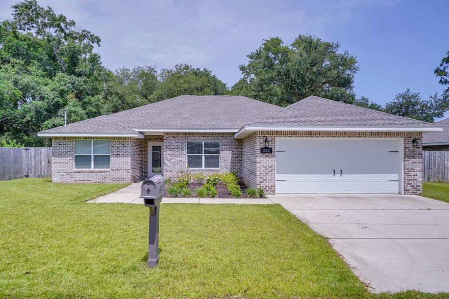 This like-new 2020, split floor plan, 4 bed, 2 bath is ready for it's new owner. Located just minutes from Hurlburt Field, this home has nine foot/trey ceilings with crown molding accented with recessed lighting, large bedrooms, upgraded kitchen appliances, custom built kitchen cabinets, granite counter tops, and  luxury vinyl plank throughout. Master bath has a tile shower and a double vanity. Back yard is fully fenced. You won't want to miss this one!