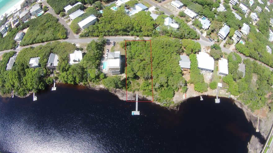 Huge price reduction! Rare Find! With only a few lots left located on Red Fish Lake, this waterfront lot is breathtaking and on a rare coastal dune lake that opens up to the gulf. The lot has approximate 81 feet of lake frontage with Florida live oaks and a beautiful Magnolia tree. The lot has a nice Trek composite dock on the water, allowing maximum views of the the lake leading to the beach outfall. Located in Blue Mountain Beach, this lot is only 800 feet away to a public beach access or paddle or kayak to the beach. Walk to Trebeache restaurant, located in Red Fish Village, then stop in at the Blue Mountain Creamery only 1,500 feet away. So many great restaurants and retail establishments only 1/2 mile away.