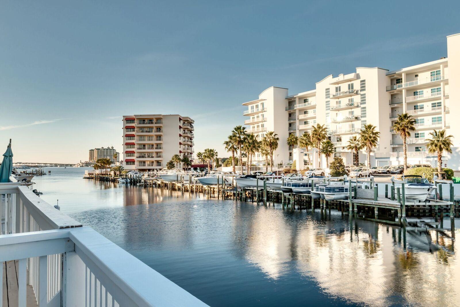 Beautifully renovated town house on Holiday Isle offering gorgeous views of the Destin Harbor and Canals. Featuring a lock out unit and a boat slip. This property has a total of 4 bedroom, 3 1/2 baths, 2 kitchens, and a large balcony over looking the Destin Harbor. Surrounded by water, with access to the private beaches of Holiday Isle just a block away and direct access to the harbor and pass this unit would make a fantastic vacation rental or personal residence.