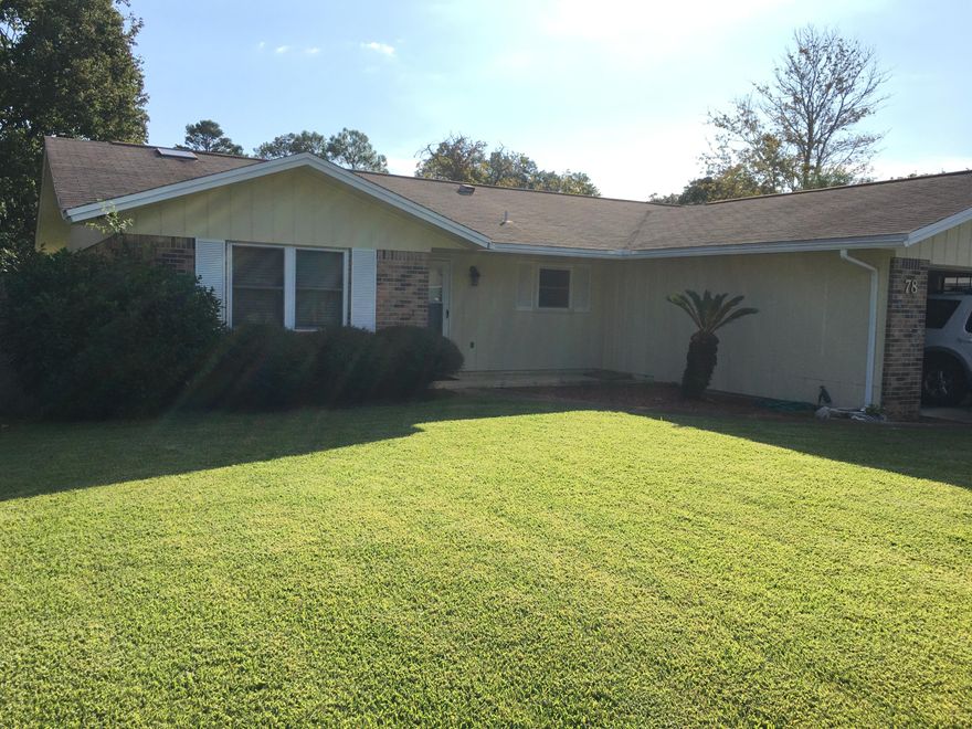 Immaculately kept home & a wonderfully cared for lot in Shalimar just minutes from either base or the beach! The kitchen wall has been removed providing simple easy flow in the spacious living area. The living room is tiled, the kitchen/dining rooms have laminated wood flooring and the bedrooms are carpeted. This home is MOVE IN ready! This all electric home comes with a wood burning fire place, refrigerator/freezer and microwave The working washer/dryer convey as-is. The Enclosed Patio (not included in the sq ft) lets you enjoy the outdoors regardless of the weather. This owner has taken very good care of this house and has all the records for all work he has had done. In the garage he is leaving labeled cans of paint for touch-up in any area that might need it after you move in!