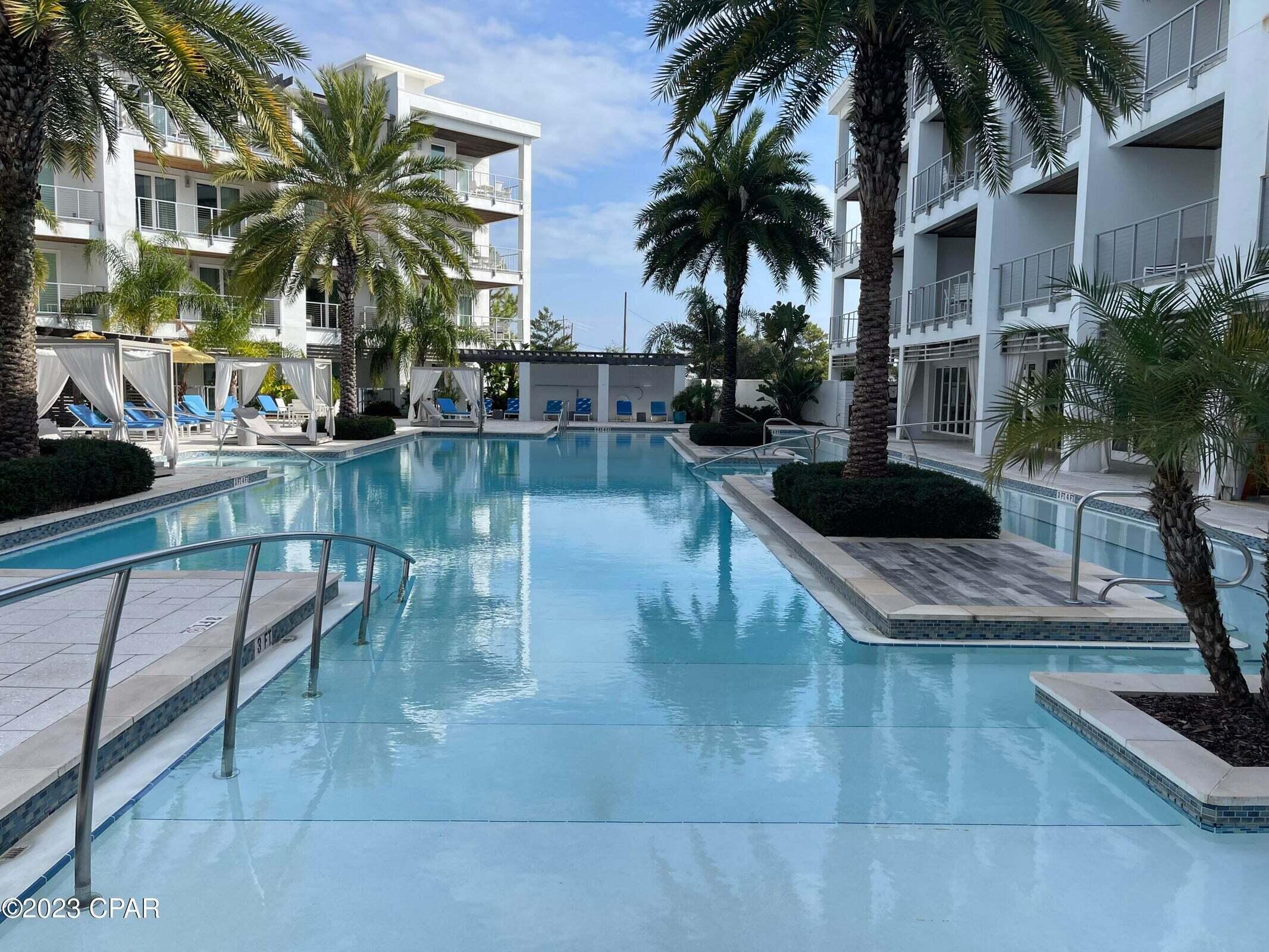 Looking for the 30A lifestyle? This spacious corner residence at The Pointe is on the 3rd floor and features 2 private balconies. A modern 3-bedroom floor plan equipped with designer furnishings. Spacious owners suite has a king bed, private balcony, desk area, bath with soaking tub and walk-in shower. The guest rooms feature queen beds and baths. Comfy living room with fireplace and sleeper sofa for extra guests. The full-service kitchen offers pretty quartz counters and gas cooktop or head down to the outdoor BBQ area. Relax at the resort pool, shaded cabanas, soothing hot tub or cozy fire pit. Stay beach ready in the techy gym with Mirror and Peloton. The poolside man cave is a perfect gathering place. Convenient building-side parking and Tesla charging stations. Pet friendly for owners