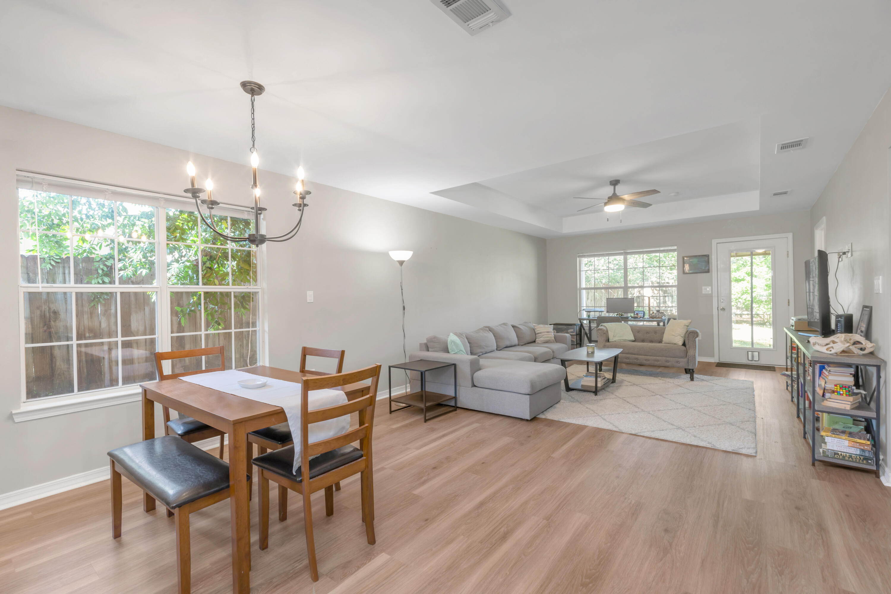 Step into this beautifully updated Niceville home, where natural light pours into the open-concept floor plan. An oversized master suite offers a peaceful retreat with a spacious walk-in closet and spa-like dual vanity bath. Luxury vinyl plank flooring, fresh paint, stone countertops, and craftsman cabinetry create a modern yet cozy feel. Enjoy the outdoors with a private, backyard with lush landscaping, mature trees, and a firepit awaits--perfect to enjoy Florida evenings on the covered porch. The attached garage offers parking and/or storage space. The seller will replace the roof prior to closing with acceptable offer! Must see!