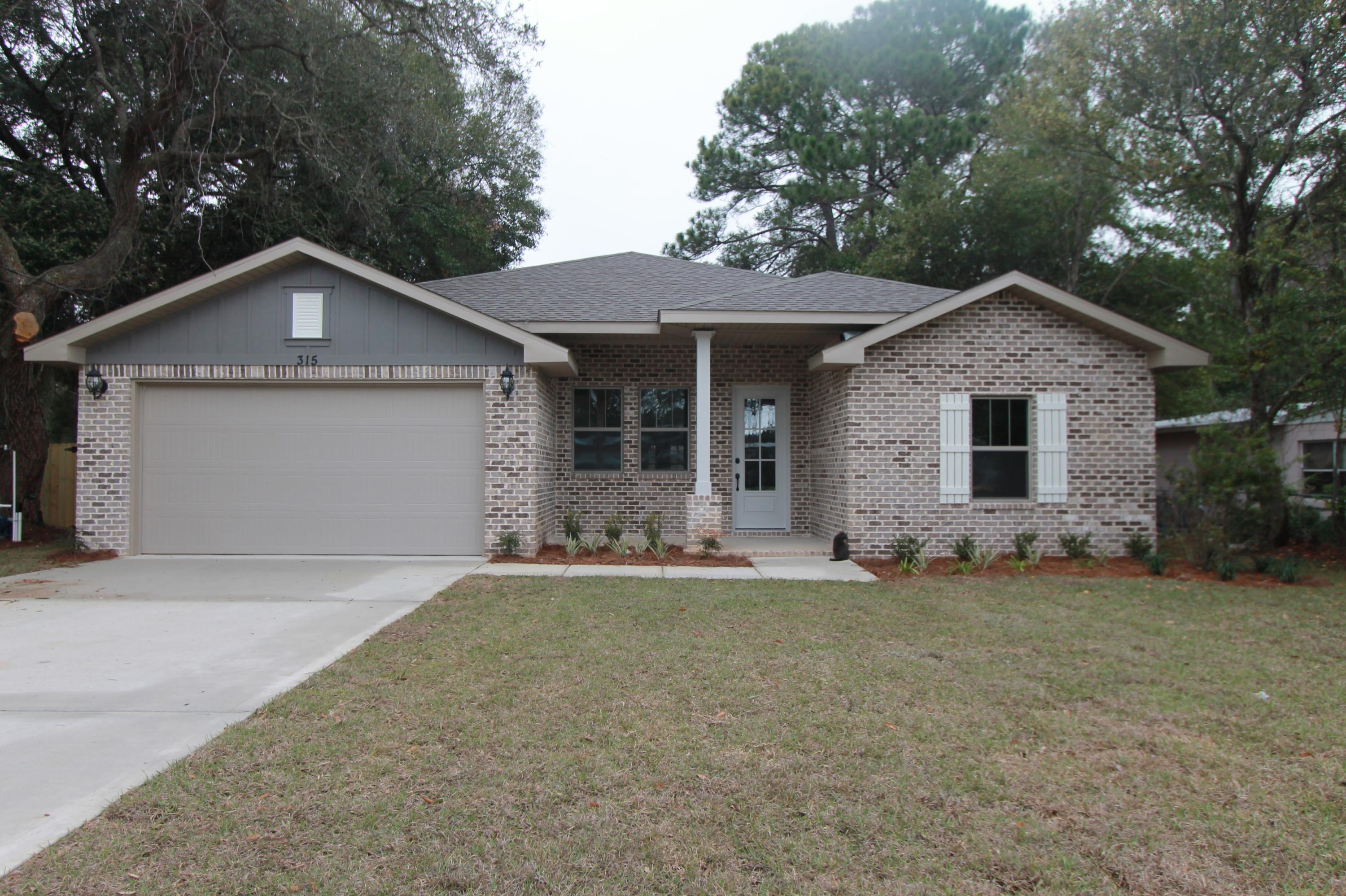 Awesome custom plan! Golf cart friendly neighborhood, super close to shopping, downtown, restaurants, and 10 minutes from Destin. This 4/3 custom brick home has super curb appeal and has been constructed on a large lot, which is a rarity. There are 10 Ft. Ceilings w/ impressive crown molding, 5 1/4'' baseboard throughout, has LVP flooring in all areas except for bathrooms, where there is tile flooring. At the front of the living room is the gourmet kitchen which boasts White cabinets, Quartz countertops, a breakfast bar and stainless appliances (including an oversized commercial grade frig./freezer and beverage cooler). All cabinetry features soft close glides and hinges. There are 2 pantry's.