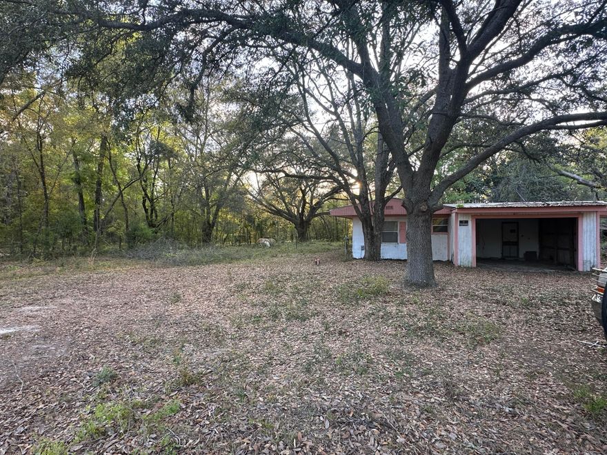 Two and one half acres directly on Hwy 77 in the Greenhead community. Greenhead is a thriving, growing community located just 36 minutes from Panama City Beach.   Hwy. 77 is a primary north-south artery connecting Interstate 10 to the coast. Daily traffic count can reach up to 20,000 cars per day, making this an excellent location for a business. The current zoning is Residential Low, allowing for 1 dwelling per acre., however the parcel to the north is commercial, making re-zoning a realistic possibility.There is a an existing block structure that is being given no value as well as existing utilities to include shallow well, septic tank and power pole. Condition of the utilities are unknown and not guaranteed.