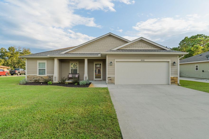 Welcome home to this gorgeous 4 bedroom east Navarre home on an oversized 0.57 acre lot (no HOA and built in 2017)! Enjoy being biking distance to the YMCA and Navarre Youth Sports Association, minutes to Navarre's beautiful beaches, and a short commute to Hurlburt Field. Enter past the lovely craftsman interior and covered front patio inside through a fantastic long entryway with a trey ceiling, crown molding, and hall closet you'll immediately fall in love with this open floor plan! With custom features throughout this beauty checks all the boxes. The well appointed kitchen is open to the dining and great room with abundant white cabinets, stainless appliances, granite countertops, lovely tile backsplash, and a walk in pantry. The kitchen island is a huge functional space with plenty of room for seating and drop down pendant lighting. The large living room has recessed lighting and hard surface flooring extends throughout the house with only carpet in the bedrooms, and the dining room as another gorgeous trey ceiling! The split floor plan leads to an owner's suite trey ceiling and the en suite bathroom is a jaw dropping oasis with double vanities, a walk in tiled shower with a glass door, and a huge walk in closet! The other three nice sized bedrooms are located on the other side of the house with ample closet space and a shared bathroom between them as well as an additional hall closet. Enter out the back door and you'll find an oversized covered and fully screened in back patio overlooking the massive backyard (it's a 297ft deep lot!). The irrigation system was expanded and the yard was fenced in once it was cleared to the property line, there is a backyard storage building, and the house is connected to sewer (no septic, so plenty of room for a pool!). Don't miss out on this gem!