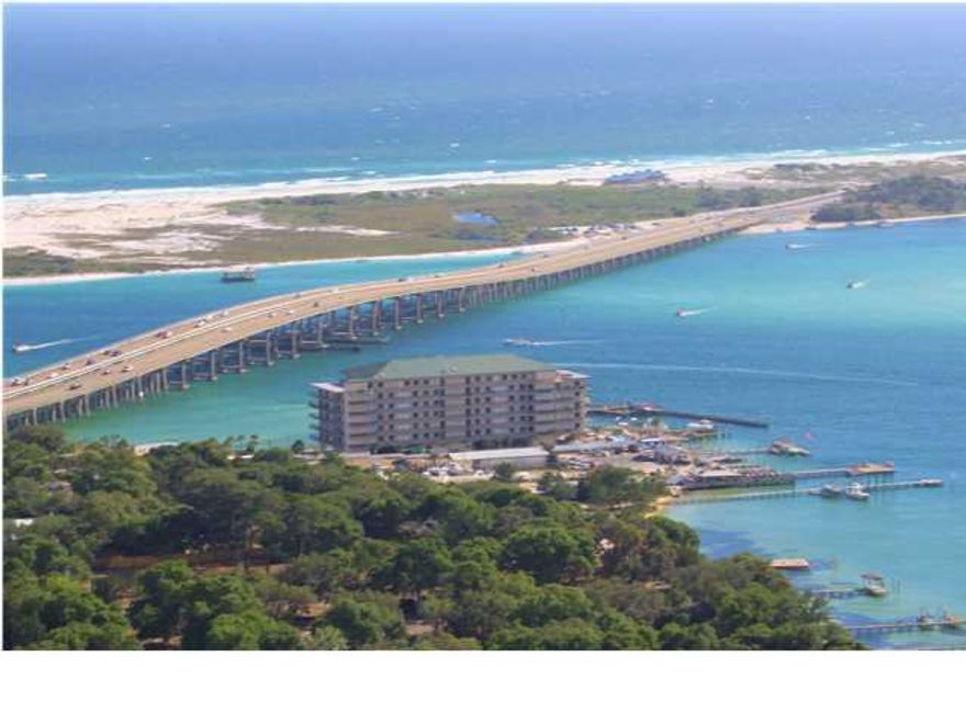 Spectacular views overlooking the Gulf, East Pass, Bay & Crab Island. Watch dolphins play, boating activity, fireworks, & gorgeous sunsets from the private balcony. This spacious 3BR condo features 10 ft. Ceiling, crown molding, tile & carpet flooring. The living/dining, kitchen, & master bedroom has breathtaking views & access to the large balcony. The master suite features dual vanities, separate shower, & whirlpool tub. Sides Moreno Point is a gated, 44 unit complex with assigned covered parking, boat dock, pool, BBQ area, community room & exercise area. Short walk or drive to shopping, entertainment, fishing & Harborwalk Village. There is also a separate boat slip w/ lift for sale for $49,000. (Boat Slip fees are $300/qtr)