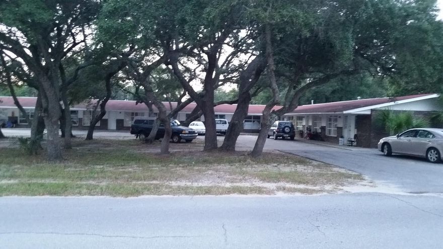 There are 12 1 bedroom units in this multifamily complex. Each unit has it's own bedroom bath and kitchen. Each unit is currently rented for $500 monthly and all tenants are on a month to month with no long term leases. This property sits on 3 lots with a total space of .72 acres.