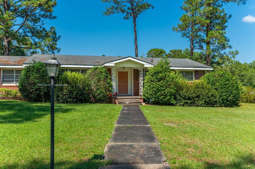 This beautiful one-story brick home is the epitome of comfort and style of years gone by. The spacious living room is designed for quality time with loved ones, while the three bedrooms and two bathrooms offer privacy and convenience. Outside, you'll love the generous corner lot, providing endless opportunities for outdoor fun, gardening, or simply enjoying the Florida sunshine. With its excellent location in DeFuniak Springs, you'll have easy access to schools, shops, dining, and more, making it an ideal choice for families and anyone seeking a welcoming community.  Do not let this opportunity pass you by! Requirements are a credit score of 600, household income of $4250 per month and one year consistently employed.
