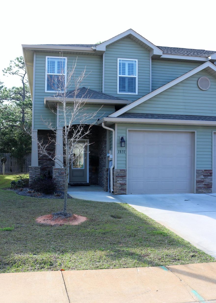 Must see this like-new townhome with Sound Access! Open design and many luxury upgrades make this an entertainer's dream. Kitchen features soft-close cabs, stainless appliances, granite, and a bump-up that allows for easy hosting to a spacious living and dining space. A vessel sink in the half bath, plus recessed lighting, plantation shutters, ceiling fans, and crown molding give a sense of elegance. Tiled flooring throughout the first floor and in both upstairs bathrooms. Easy maintenance with a painted patio that has been expanded with pavers and completely enclosed by a privacy fence. Upstairs you will find three carpeted bedrooms, beginning with a large master and en suite that includes a porcelain tub with tiled enclosure (and seat!), dual vanities, and walk-in closet.
