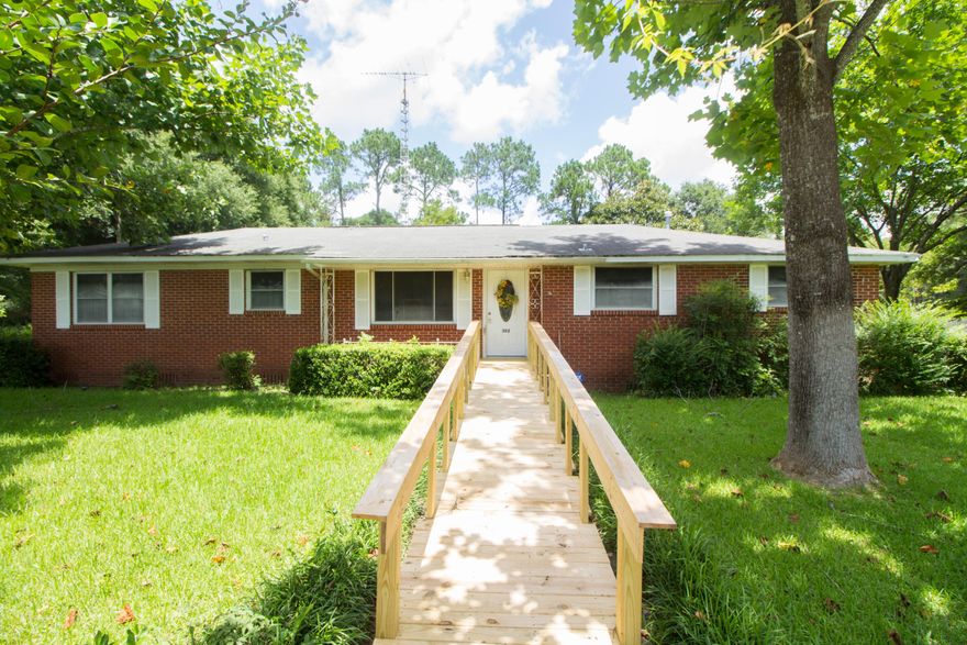 This classic red brick 3/2 home is located in the center of Crestview allowing you to have easy access to all the local bases, shopping centers, and a quick drive to the stunning panhandle beaches. The beautifully landscaped yard is fenced in all around and also has a irrigation system. There is a small yard building for extra storage located in the back. Seller had updated the kitchen as well as the windows. When you walk in you will right away notice the original, stunning hardwood floors.The home offers a formal living room and a den for entertaining guests. Supper time? Come sit in the spacious formal dining room ready for the whole family. Don't let the age fool you, this home has been well maintained. Schedule your showing today!!!