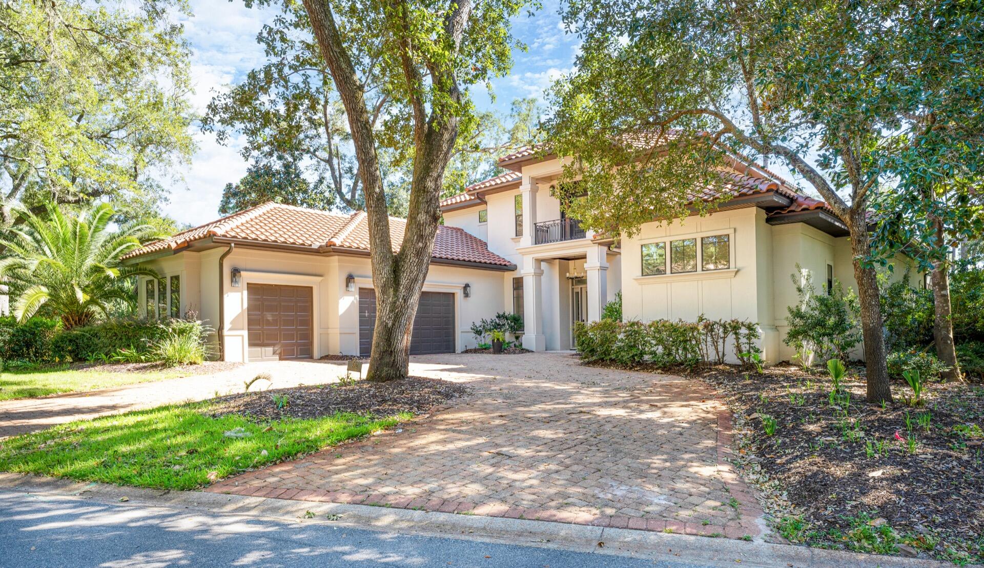MAJOR PRICE REDUCTION. Beautiful Home situated in the Very Private Quiet cul-de-sac of The Oaks at SANDESTIN GOLF & BEACH RESORT.  This Burnt Pine home was Designed with Family in mind - capturing the Ultimate in Living and Entertaining. This 5 bedroom, 7 bathroom home features a Main Level Master Suite. The Private Master Suite features a Fireplace, 2 Large Walk-In Closets, Separate Vanities and a Walk-Through Shower. The Main Level also Includes an Office, Dining Room, 2nd Living Area, Laundry Room, Butler's Pantry,  Guest Bedroom and Gourmet Kitchen with an Island, Upgraded Appliances, Bar and Pantry. The Kitchen flows into the Family Room and Features a Wall of Sliding Glass Doors that Open up to a Spacious Covered Porch featuring a Summer Kitchen and Pool.Upstairs, 3 Bedrooms 3 Baths