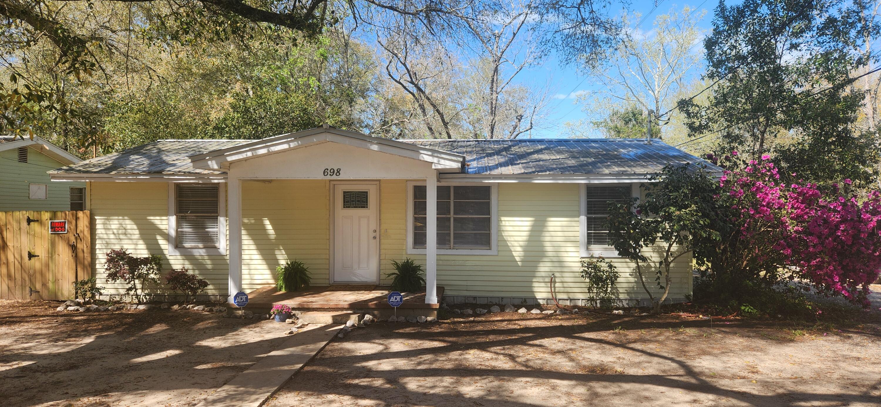 Great affordable home on a corner lot with lots of upgrades and Ready to MOVE IN! 4 bedrooms 2 full baths, new flooring, updated kitchen and baths with fresh paint. All appliances convey including refrigerator, washer and dryer. Nice security fenced backyard with gates. Great for the first time buyer or investor for rental income. Seller will provide a one year home warranty for peace of mind! Come and look today!