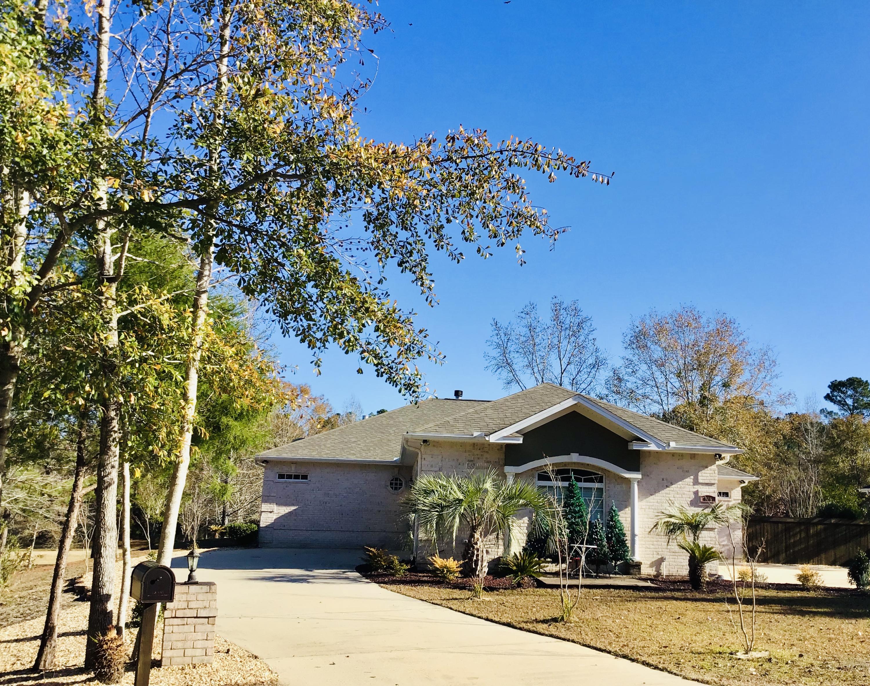 Custom Built split bd-rm 2500 sq ft. 4-bedroom Brick home on large lot plus a 1 -bedroom studio with private bath, making a total of 5 bedrooms and 3 1/2 baths. Studio is not included in sq footage. Need a home with a lot of parking ...this is it. Home is move in ready and 2020 updates and upgrades are impressive. Starting with a new roof, two 40-gallon hot water heaters, whole house water filtration & water softener. All new appliances. New Hardwood floors and so much more. Interior walls and trim painted. Complete list available. You enter through Beautiful 9 ft. Mahogany double doors with leaded glass to foyer with marble tiles. Dining room has hardwood floor and tray ceiling w/ double window & plantation shutters. Kitchen has granite counters, breakfast bar, two sinks,