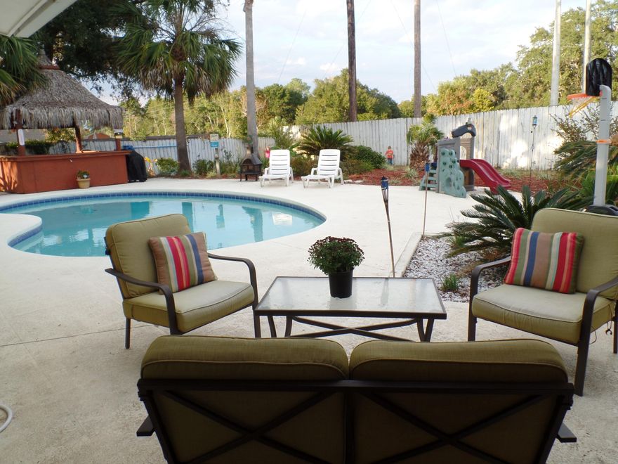 BACK YARD PARADISE... Gunite Swimming Pool, Tiki Bar, Fenced Private Yard with an Outside Diverse Building totally finished inside and out! THIS IMPRESSIVE 4 BEDROOM home has been TOTALLY RENOVATED...new dimensional shingle roof, kitchen, granite counter tops, stainless steel appliances, hvac, hot water heater, crown molding, plantation shutters, 5'' cottage wood laminate plank flooring, travertine flooring, travertine MB shower and guest bath tub surround. NOTHING HAS BEEN SPARED!GREAT LOCATION...CONVENIENT to shopping, restaurants, beach, medical facilities and both Eglin & Hurlburt AFB.