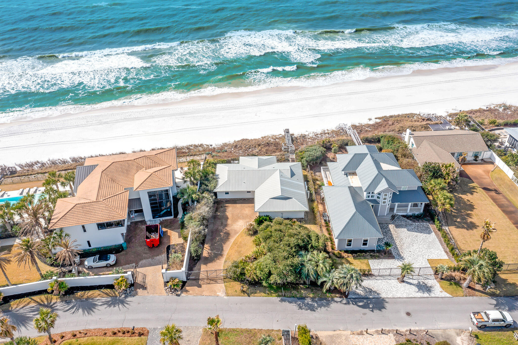 Spanning 76 feet of Gulf-frontage on 30A's popular east end, this charming beachfront home is poised in the gated community of Pelican Pointe.  The gulf-front community of Pelican Pointe directly neighbors Camp Creek Lake, and offers a uniquely quiet setting, while just a short walk or bike ride to the bustling town centers of Alys Beach, Rosemary Beach, and Watersound.  The residence is gated, offering an additional layer of privacy.  Escape to your coastal paradise on this private, deep homesite boasting an expansive beach frontage and stunning Gulf views. The coastal lifestyle of the sought-after east end of 30A cannot be matched, and you will enjoy the sanctuary location while being only a walk or bike ride to the liveliness of the popular planned communities of Alys Beach and Rosemary