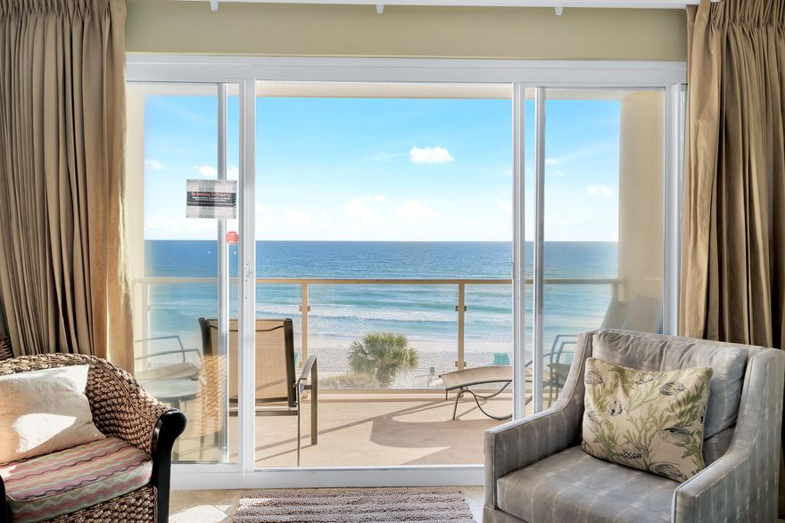 This 2 bed/2 ba condo is located in desirable Sterling Sands where you are close to shopping and dining. It is located on the 5th floor overlooking the Gulf of Mexico and its private beach. The view is UNBELIEVABLE!!!! The glass rails maximize the view of the Gulf of Mexico from the balcony. The kitchen and living room are an open layout. Enjoy cooking while admiring the beautiful view.  In addition to this condo being sold fully furnished, it also conveys with DEEDED PRIVATE GARAGE PARKING SPACE. Other features are: Nice tile throughout, NO CARPET, granite countertops in kitchen with steel appliances, owner's closet, stackable washer & dryer.  GREAT INVESTMENT OPPORTUNITY! Sterling Sands features 460 feet of sugar white beach with daily beach setups, gulfside pool and hot tub, fitness