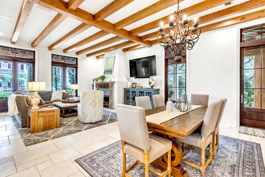 'Spare-no-expense' renovation in the guard-gated, gulf-front community of Caribe!  A short stroll down the tree lined streets takes you to the private deeded beach for full neighborhood use!  Breezy, 400 square feet of deep porches invite guests outside for morning coffee, as well as evening gatherings after a day at the beach. This iconic, distinctive four bedroom home is a favorite among the community. Restored historical double doors open to the foyer with a sweeping 20' ceiling and a curved stairway. The open-concept living and dining area boast wooden beams and a statement fireplace. Newly designed kitchen and bathrooms bring the perfect blend of modern sophistication and classic European flare.