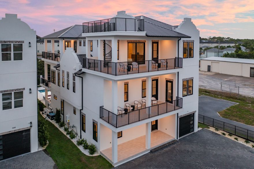 This one-of-a-kind new construction home is ready for you! It is an exceptionally designed home that boasts three vertical levels with over 5100 square feet. This luxury home offers multiple living spaces, nine bedrooms, nine full bathrooms, one half bathroom, a private garage, additional parking, ample outdoor space, and resort style private pool located minutes from the white sandy beaches of the Gulf of Mexico!  Upon entering you are pleasantly greeted with plenty of room for entertaining, a wet bar, and access to the first level outdoor living space. The ground level open-air living room offers a resort style oasis boasting a large pool and outdoor grilling area. Off of the living area, you gain entry to two king guest suites and a bunk suite. This level also features a private garage, laundry facility, and access to the residential elevator. The main level of this home is found on the second floor. Entrance onto this level welcomes you into the gorgeous spacious great room. This room features a massive chef's kitchen holding a grand island, high-end luxury appliances, custom cabinetry, beautiful countertops, walk-in pantry, and a large dining area. This floor also features two king suites along with a bunk suite. The expansive open concept living area is an entertainers dream and perfect for large gatherings. Once you make your way outside to the covered balcony there is also plenty of seating overlooking the pool.

Access the third level using the residential elevator or through the striking stairwell. As you arrive on this floor, you will find a modern style oversized sitting area with four king suites on the left and right of this area. Pick your poison with beautiful deck views on the front or back of this home. At the end of this balcony is a spiral stair case that leads to the fourth floor rooftop observation deck with panoramic views. Relish bewildering sunsets from the spacious rooftop. This estate would make the perfect second home or permanent residence. Huge rental income potential solidifies this investment opportunity. 
