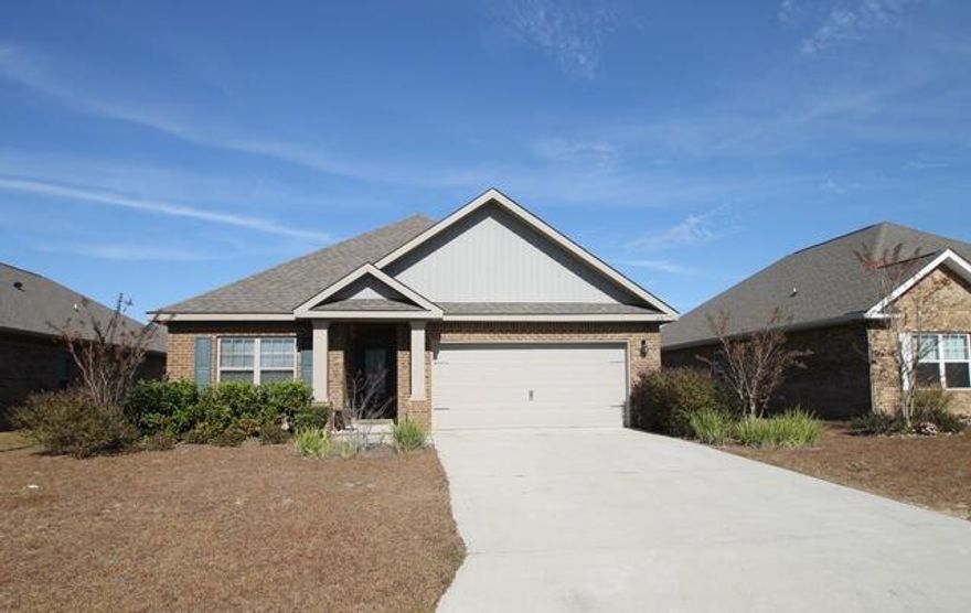 Beautiful well cared for home in the convenient location of  popular Redstone Commons on the south side of Crestview. Split bedroom floorplan is designed with a really open living area showcasing the large granite covered kitchen island and eating bar. Kitchen features all stainless steel appliances including the nice refrigerator with icemaker.  There is also a dining area off of the kitchen and a good sized living room that is part of the open area. Great master suite with walk in closet, separate shower, garden tub, and dual vanity sinks.  Luxury vinyl plank flooring in all areas except bedrooms which have like new wall to wall carpet.  All brick exterior with a covered rear porch and double car garage.  Back yard is almost entirely privacy fenced.  Tenants in place until April 30.