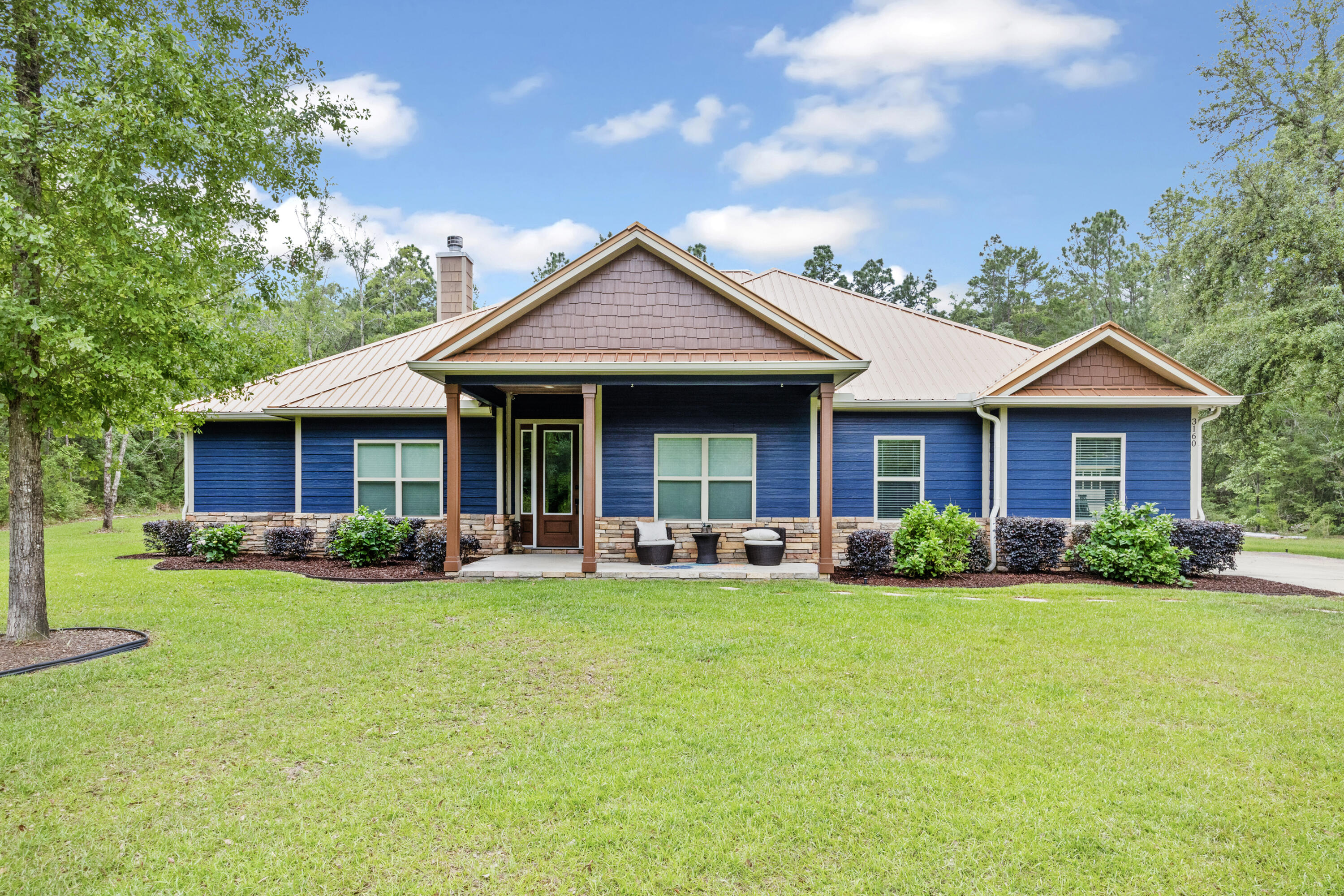 Come and take a look inside this immaculate 2018 built, 3 bedroom 2.5 bath home located in North Crestview! Beautiful LVP and tile all throughout the house, with an open floor plan, including a huge stone covered fire place in the living area with tray ceilings. Entering into the kitchen you are greeted with all stainless steel appliances, a double stack oven/microwave setup, a huge walk in pantry, boasting beautiful hard surface counter tops, an amazing one bay custom copper sink and so much more!! The master bedroom also offers tray ceilings for a vaulted feel! The master bathroom is right off the master bedroom with masterful tile work and a separate tub with double vanity sinks. 2 car garage including a separate motorcycle or golf cart storage! The home is situated on 2 acres of land so the possibilities are endless to what you can make with a blank canvas! There is also a large pole barn in the backyard that could be closed in to make the perfect workshop or storage building. Schedule your showing today for this stunning home and see everything it has to offer the new buyers!!!!
