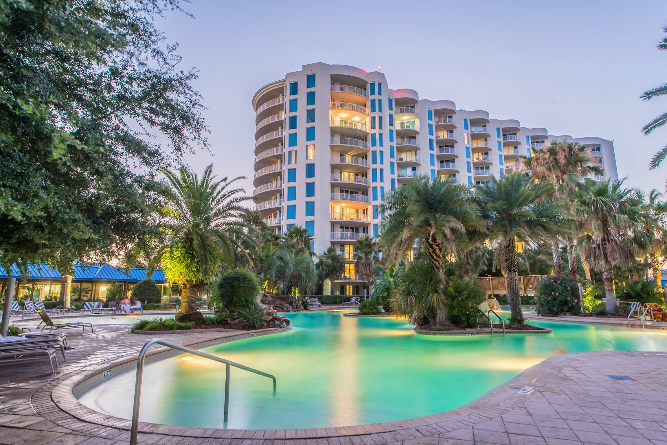 Your dream beach condo has arrived and under $370,000! Take in stunning nature views and sunset views from you oversized private balcony. This rare 1st floor unit features a kitchen that boasts endless granite countertops, expansive wood cabinetry, and so much more! The master bedroom features a private entrance to the deluxe size balcony. Tastefully decorated with gorgeous furnishings throughout, multiple large flat screen tv's in the living area & both rooms, and your own washer & dryer complete this beautiful unit. Your friends, family and vacationing guests will enjoy the 11,000 square foot, 259,000 gallon zero entry pool which is DESTIN'S LARGEST LAGOON POOL, hot tubs, 5 dancing waterfalls, walking bridges, spacious lounging area +more! Take the shuttle to the Beach!