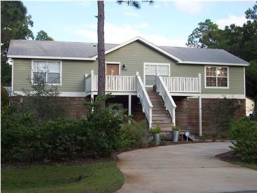 BACK ON MARKET. SHORT SALE. Excellent opportunity to get a great house and a huge garage with plenty of storage space at a great price. This is a 3BR/2BA 1456 sq.ft. home with open-concept living area. Travertine floors throughout kitchen, living, dining & foyer, as well as the MBA and the 2nd bath. All bedrooms have Canadian Maple Hardwood floors. MBR walk-in closet. Kitchen has Pecky Cypress Wood cabinets and stainless steel GE appliances, double door refrigerator, double ovens, smooth cook-top and a commercial exhaust hood. Kitchen also has granite countertops with deep kitchen sink & a commercial-style pre-rinse faucet. Ceiling fans throughout. Home has Hardi-Plank siding & a shingle roof. Home is on pilings. The ground level (approx. 1456 sq.feet) is garage/workshop/storage.