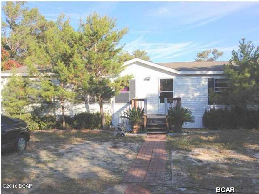 PRICE REDUCTION! MOTIVATED SELLER!PLEASE SHOW AND BRING OFFER!Positive income, cash flow Opportunity. Long term tenant pays $900 monthly and maintains the property meticulously. Tenant pays all utilities and maintains yard. The home sits on the quiet west end of Panama City in an established, quiet neighborhood. This well maintained property is only 900 feet from stunning lake Powell. In addition it is just minutes from Pier park and historic 30A.