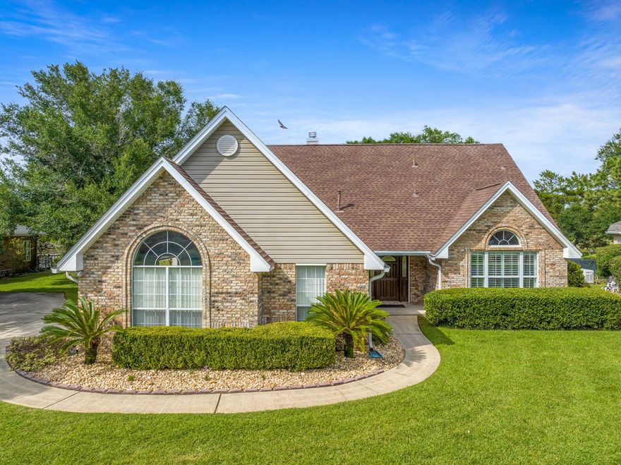 Beautiful & Spacious!!  5 Bedroom, 2 -1/2 Bath home with office/bonus room, dining area and breakfast bar. Kitchen features top-of-the-line Thomasville cabinetry, granite counters, and a dual fuel (gas top and electric range) stove for quick and even heat. Home is accented with crown-molding, plantation shutters, tile and luxury vinyl plank flooring. Downstairs master suite features large walk-in closet, granite counters, jetted tub and separate shower. Outside, the patio features a built-in grill and pergola providing a great entertainment area, with a great view of the 10th fairway. Oversized garage - features cabinets and work-area with sink.  Roof 2019, HVAC 2022, Generac generator 2021. Enjoy Florida Living at it's finest!  Call for your showing today!!