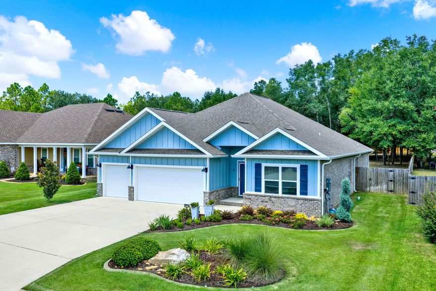 This home truly lives up to the phrase - BETTER THAN NEW! Built in 2021, this 4BR/3BA home with 3-car garage has upgrades that  go beyond new construction. Features include a brand-new shop/storage building with roll-up door & awning (3 months old), custom master closet (Closets By Design), granite counter tops throughout including a double vanity in main bath, 15'x12'6'' covered patio, professional landscaping, sprinkler system, gutters, a large, 304' deep lot with a fully fenced backyard. Low-maintenance brick & Hardi-Plank siding. All appliances convey--including washer, dryer & extra garage fridge. Convenient to Hwy 90 & I-10. Just 9 min to the Milton Riverwalk - 30 min to Pensacola Airport - 36 min to Navarre Beach & 40 min to Pensacola Beach.  Truly move in ready!