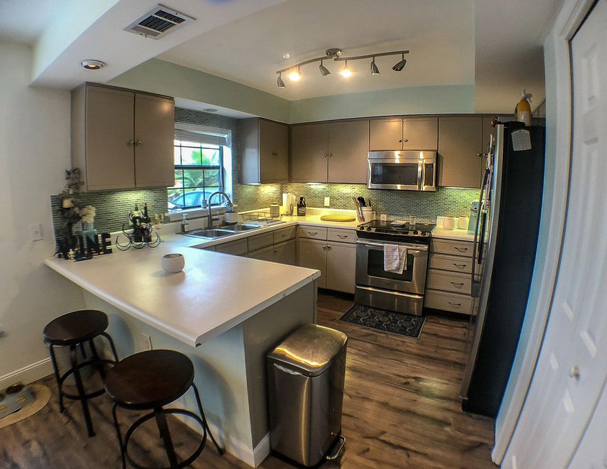 Court Del Mar sits on 60ft of waterfront canal in the much desired Holiday Isle. The beach is a short walk away with 2 beach accesses near by. Inside the kitchen you'll find stainless steel appliances, large pantry, and plenty of counter space with a breakfast bar. Lots of natural light flows into the living room with laminate wood floors. Either bedroom could be made into the master, both have their own en suite bathroom with double vanities and ample closet space. There's extra space upstairs on the loft that could be made into an office, craft room, or anything else. This location is close and convenient to shopping, grocery, entertainment and restaurants!Motivated Sellers offering $5,000 for buyer furnishings/closing costs with full price offer!